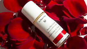 Dr. Hauschka Natural Deodorant lying in a bed of rose petals.