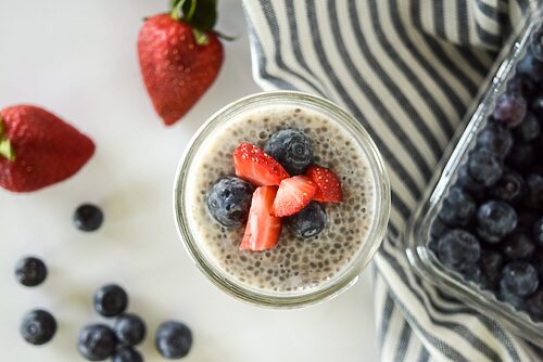 Vegan Chia Seed Pudding - A delicious and nutritious vegan pudding made with chia seeds, almond milk, maple syrup, vanilla extract, sliced almonds, and fresh berries.