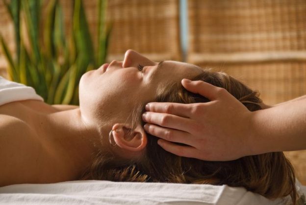 Felicity performing Energy Massage with sacred oils to relieve stress and promote healing